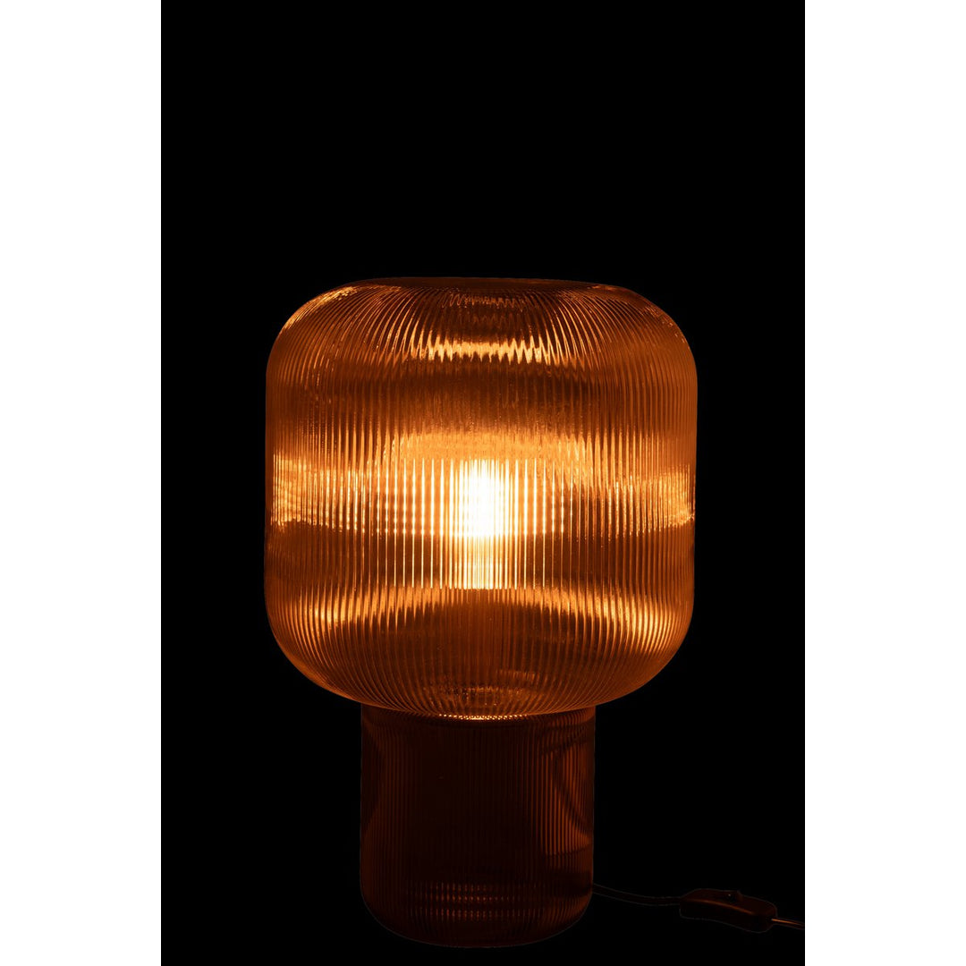lampe de chevet en verre transparent marron.