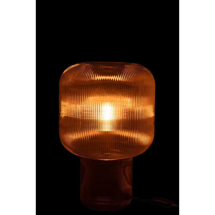 lampe de chevet en verre transparent marron.